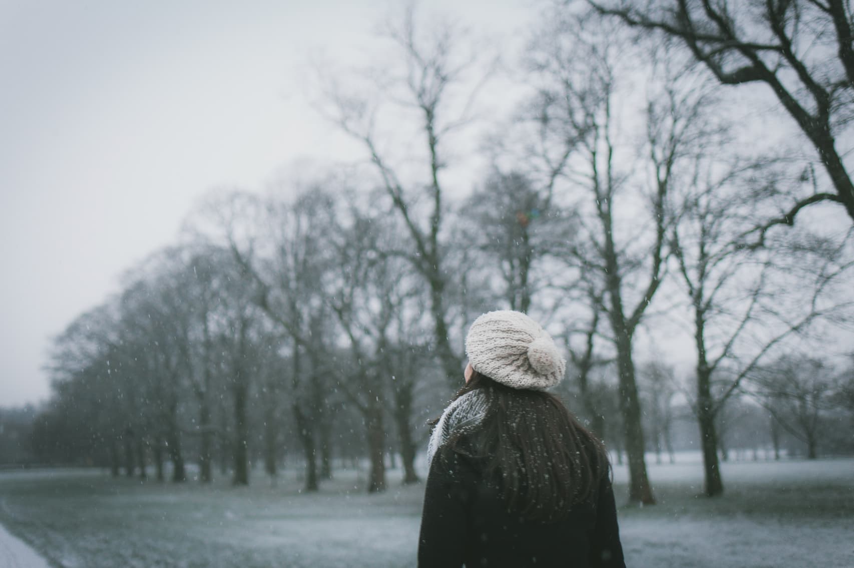 woman walking outdoors during winter time