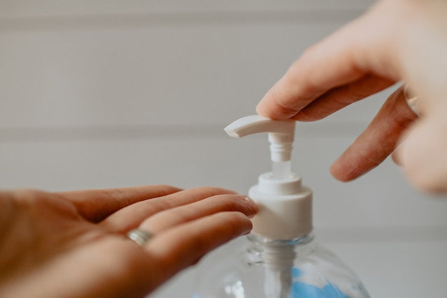 A person using hand sanitizer during the COVID-19 pandemic