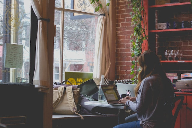 Woman using a self-love journal as a daily tool for a better life
